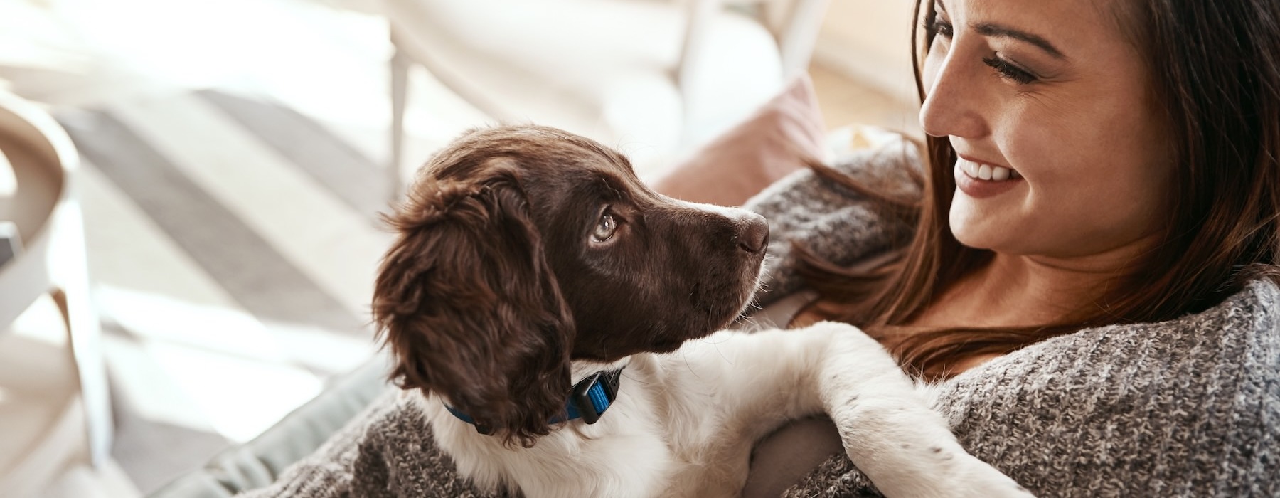 a woman holding a dog