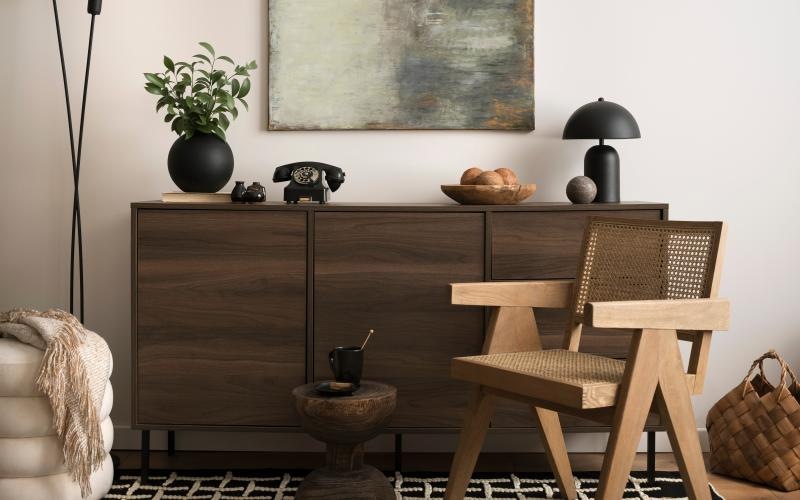 a room with a dresser and a chair